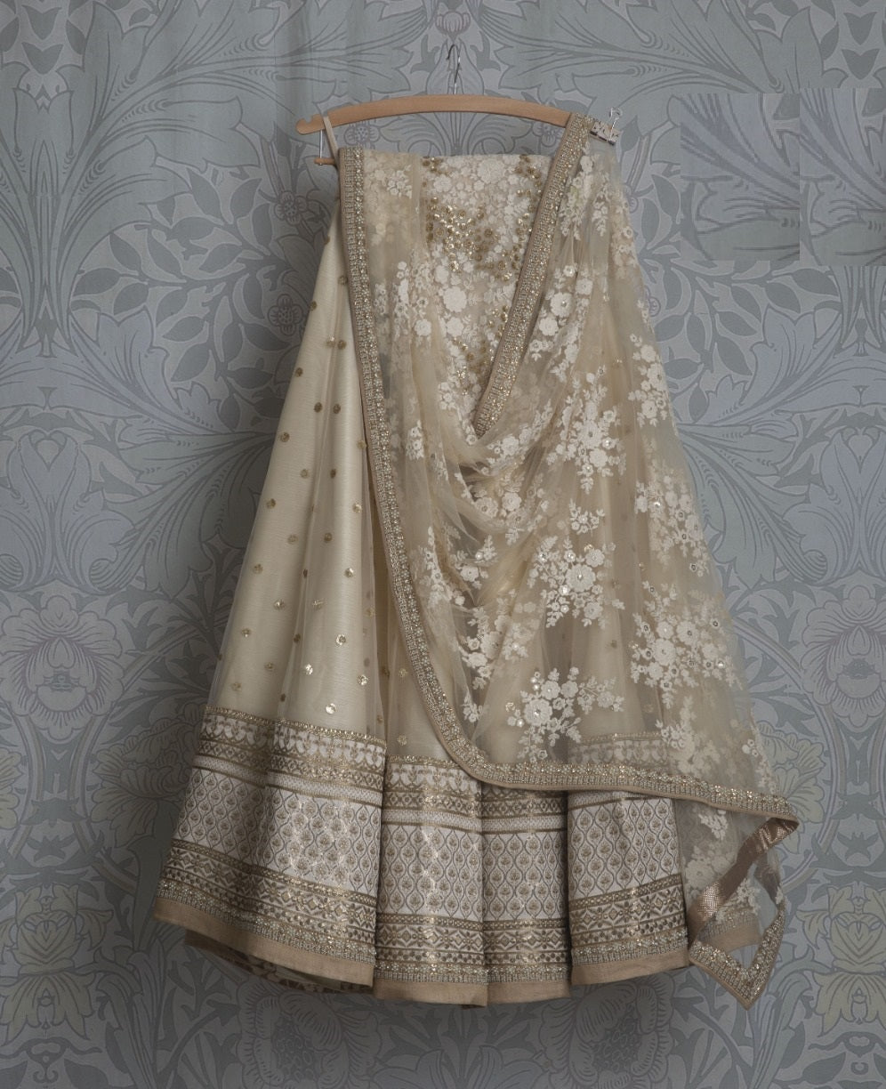 Cream Lehenga Choli In Soft Net With Zari Work