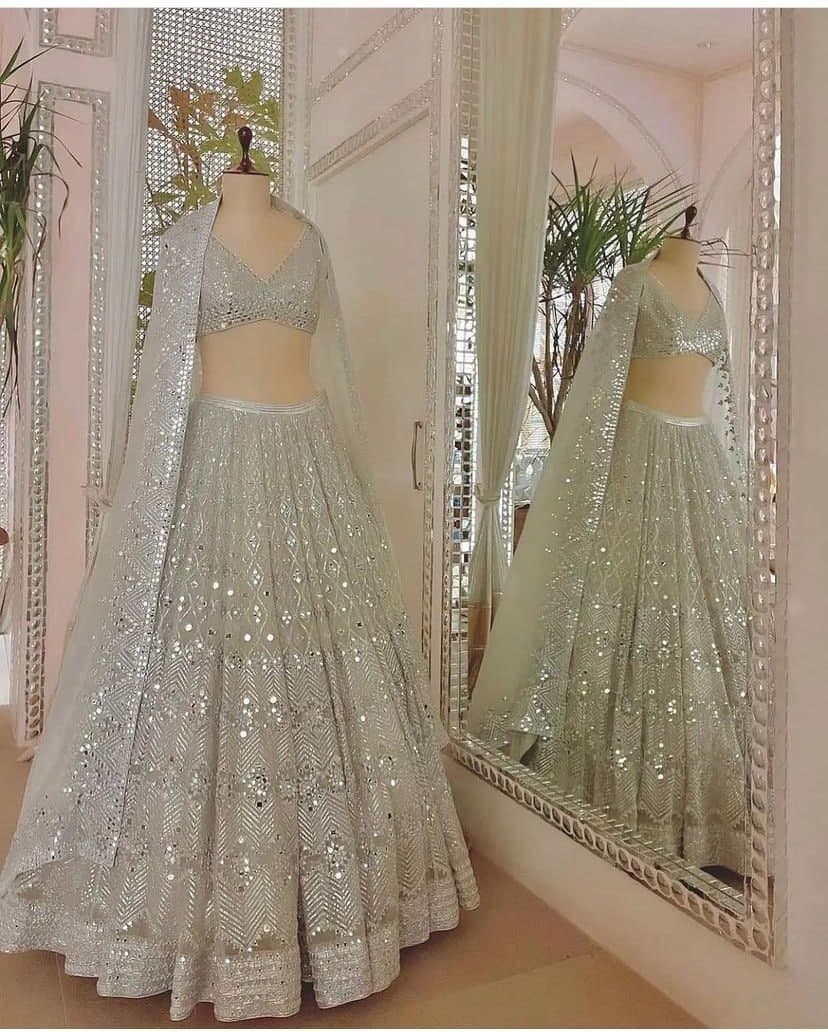 Light Pista Lehenga Choli In Butterfly Mono Net With Real Mirror Embroidery Work