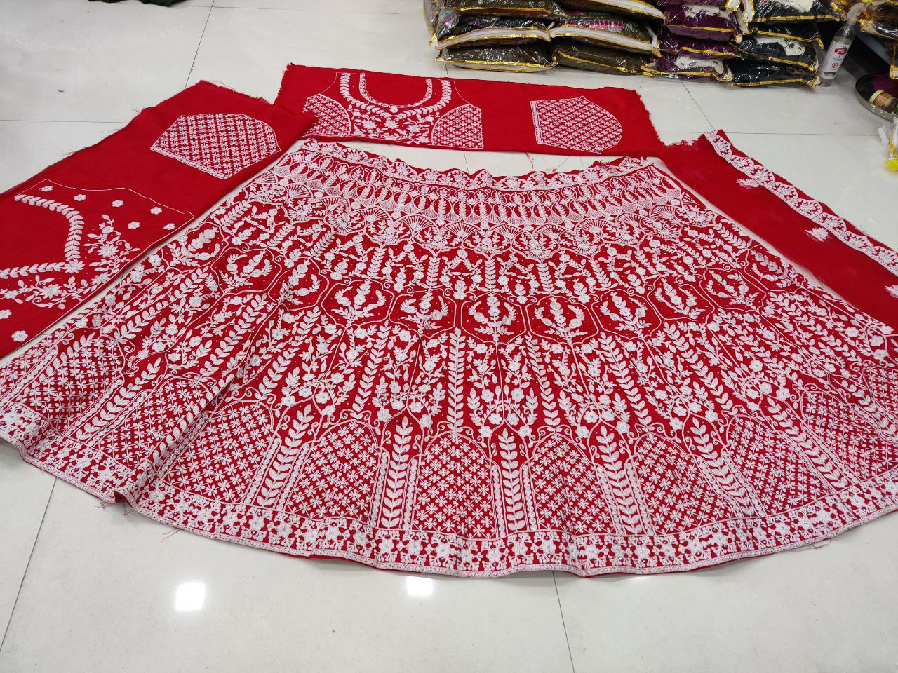 Red Lehenga Choli In Phantom Silk With Heavy Chain Stitch Work