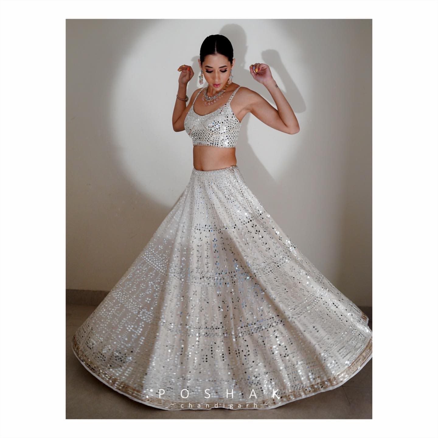 White Lehenga Choli In Fox Georgette With Paper Work