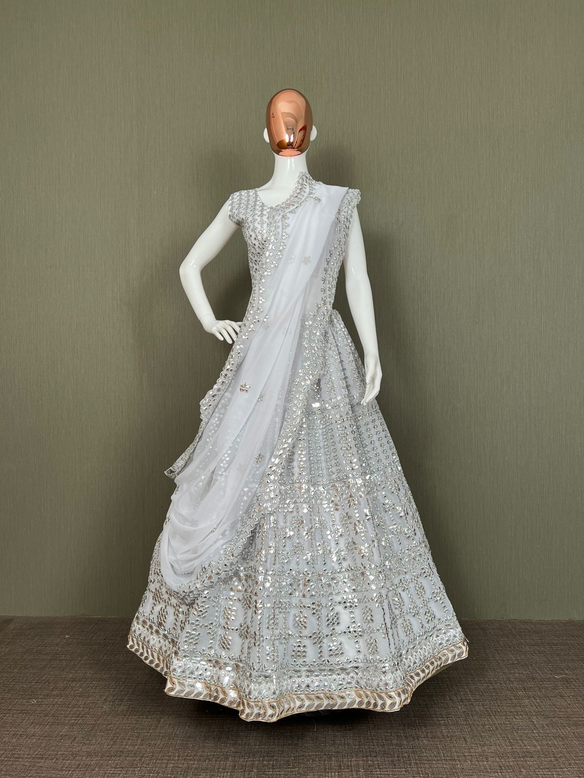 White Lehenga Choli In Fox Georgette With Paper Work