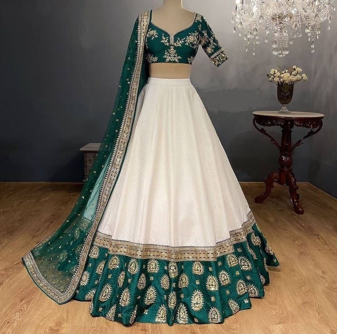 White Lehenga Choli In Heavy Chinon Fusing With Zari Sequence Work