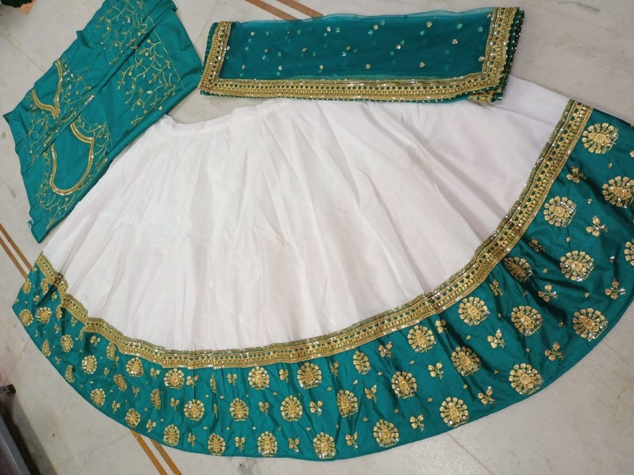 White Lehenga Choli In Heavy Chinon Fusing With Zari Sequence Work