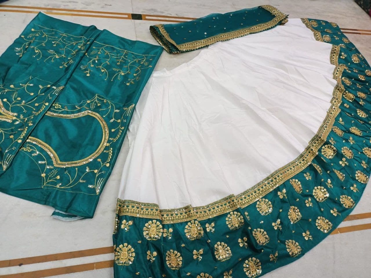 White Lehenga Choli In Heavy Chinon Fusing With Zari Sequence Work