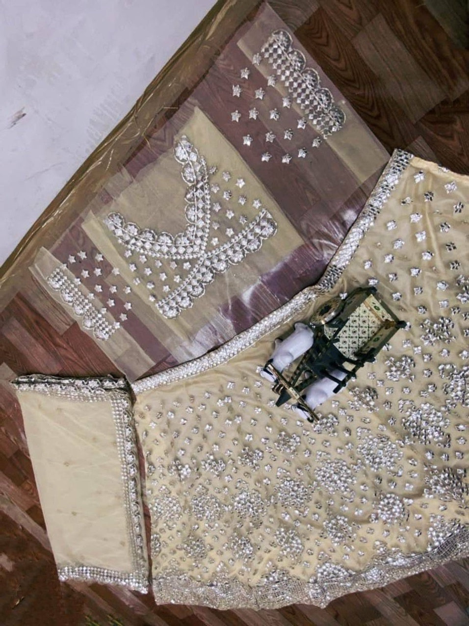 Cream Lehenga Choli In Soft Mono Net With Foil Mirror Embroidery Work