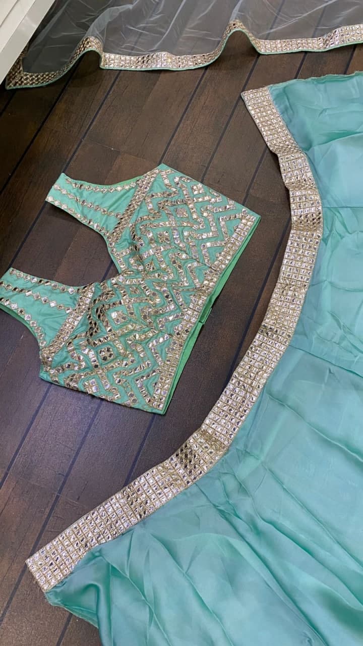 Aqua Lehenga Choli In Heavy Kasturi Silk With Foil Mirror Border Work