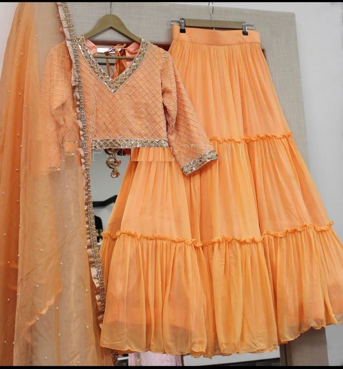 Orange Lehenga Choli In Fox Georgette With Ruffles