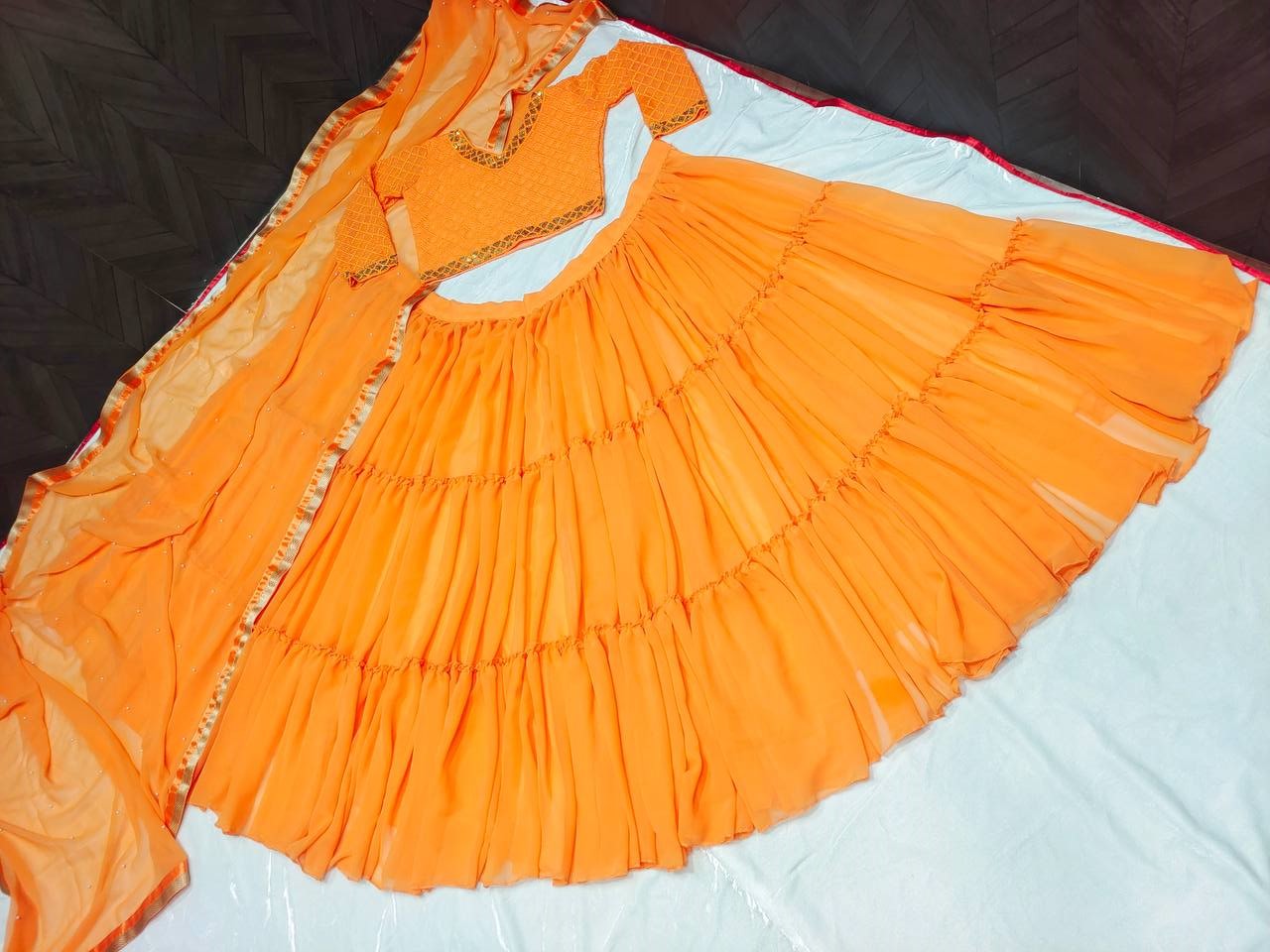 Orange Lehenga Choli In Fox Georgette With Ruffles