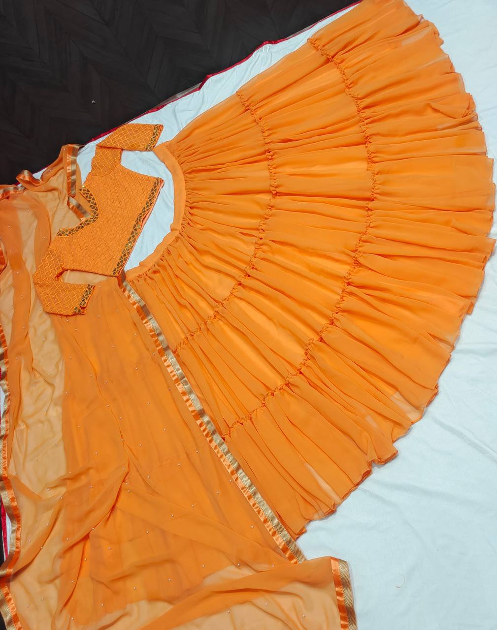 Orange Lehenga Choli In Fox Georgette With Ruffles